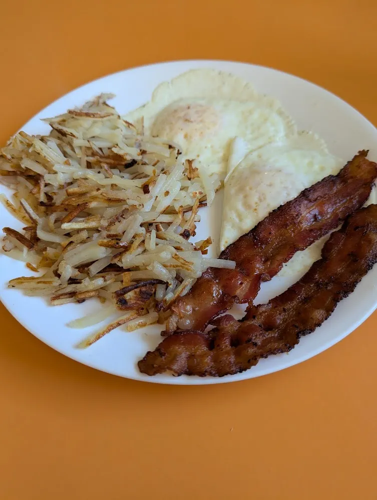 2 Eggs over Medium Hash Browns and Bacon